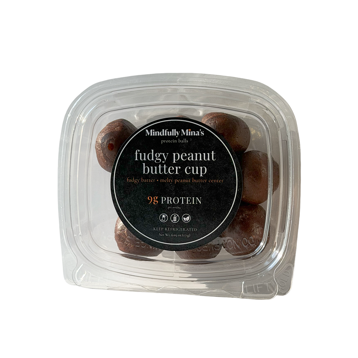 A clear plastic container of fudgy peanut butter cup protein balls with a round black label reading “Mindfully Mina’s protein balls, fudgy peanut butter cup, fudgy batter, melty peanut butter center, 9g protein, keep refrigerated.”