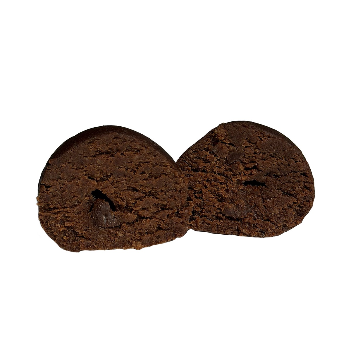 A brownie batter protein ball cut in half, showing a dense, dark chocolate interior with a small chocolate chip visible inside a pocket on one half.